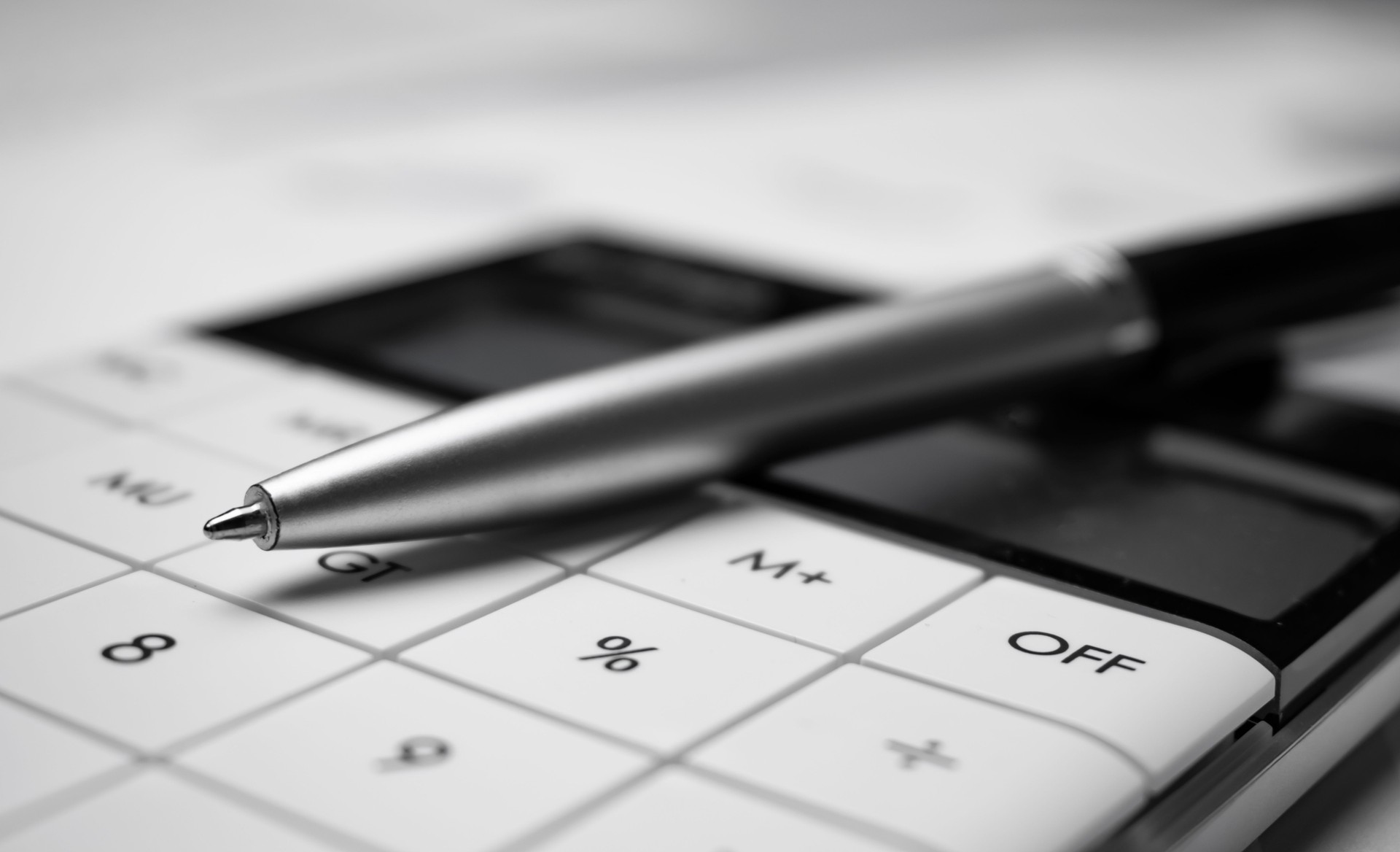 Financial accounting with tax documents, pen and calculator. The concept of business and finance.
